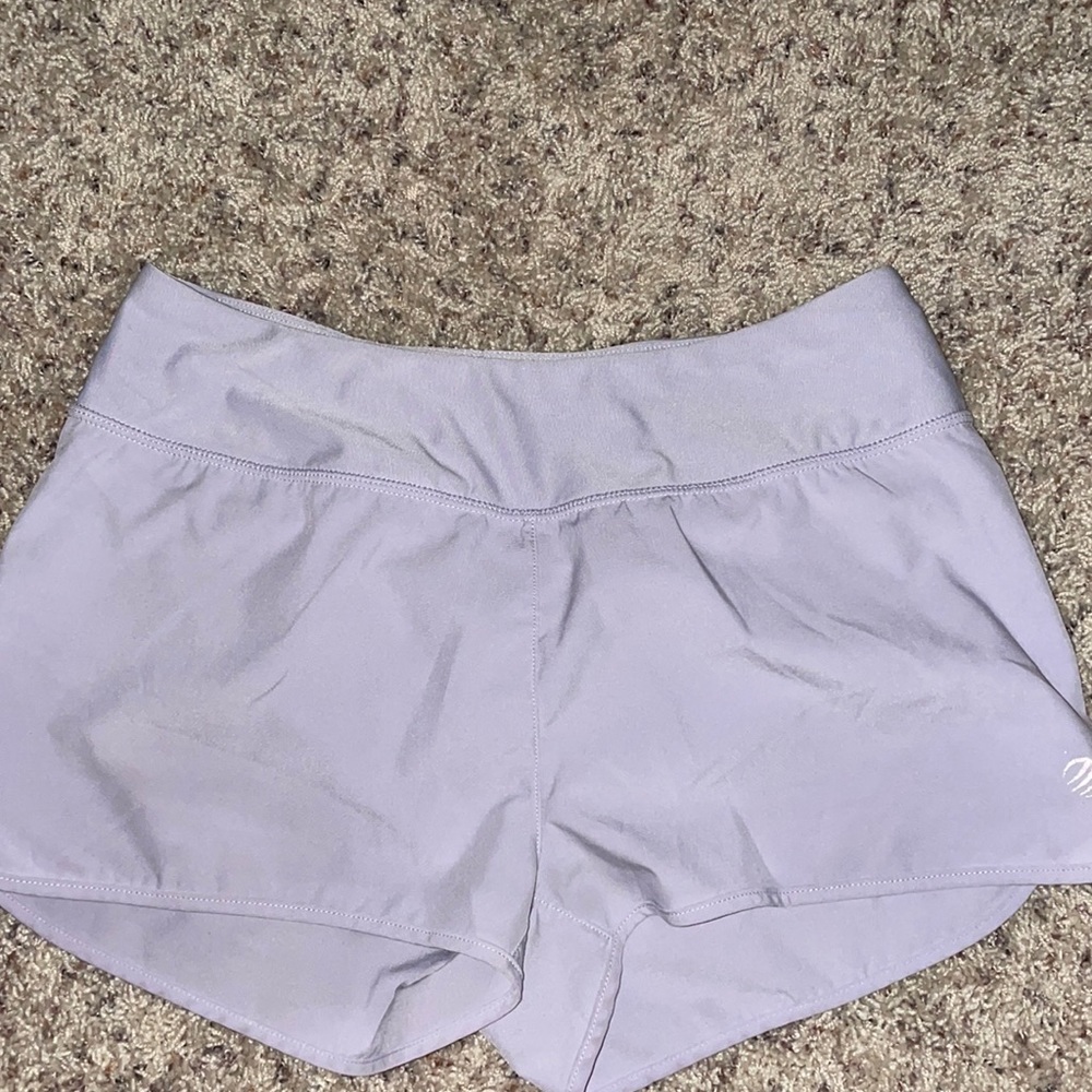 Purple athletic shorts with zipper pocket